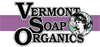 Loggan utgörs av texten Vermont Soap Organics. I en cirkel finns en illustration av en dam i hatt från svunna tider, 
